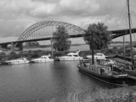 The city of Nijmegen at the river waal in the netherlands photo