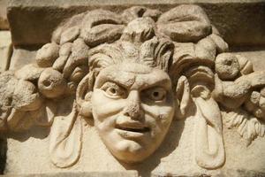 Ancient Mask Relief in Aphrodisias Ancient City in Aydin, Turkiye photo