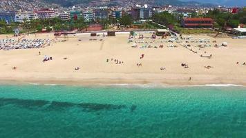Alanya  beach, panorama. Panoramic view of the sandy beach. The sea wave rolls on the shore. Sea coast view from the air. Aerial photography of the sea wave. The ocean and beach. video