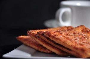 stack of cracker on the white plate photo