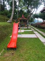 Modern Playground Equipment. Modern Colorful kids playground on yard in the park photo