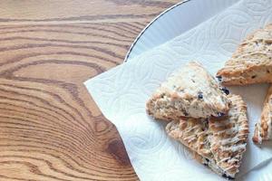 blue berry scones served in white plates photo