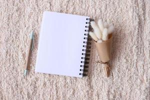 Blank notebook with dried flower photo