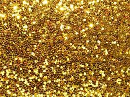 golden christmas background with glitter texture photo