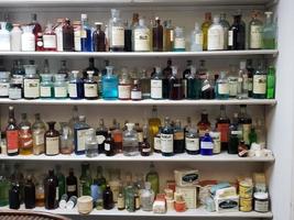 a shelf of old veterinarian supply photo