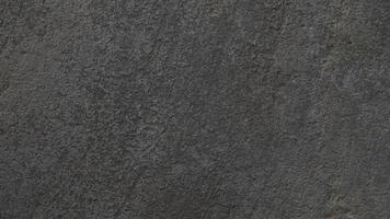 Textured gray concrete background. Old wall or floor made of dark gray cement. Scuffed and cracked. Copy space. Attrition. photo