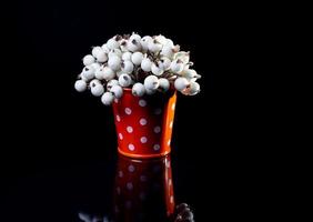 aluminum ice bucket laid in wait for use. stainless multi-colored bucket with white green blue berries in ice photo