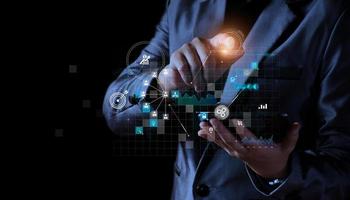 Business man using tablet on global network connection on investor and customer with sale data exchange and development of business. Technology and digital marketing. Financial and banking. photo