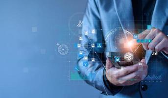 Businessman using mobile smartphone on global network connection on investor and customer with sale data exchange and development of business. Technology and digital marketing. Financial and banking. photo