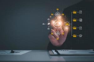 Document management system concept, business man holding folder and document icon software, searching and managing files online document database, for efficient archiving and company data. photo