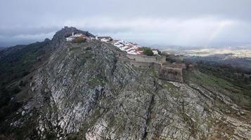 Aerial drone view of Marvao, Historic Villages of Portugal. Castle and old town inside of a fortified wall on the cliff of a mountain. Rural tourism. Holidays. Best destinations in the world. photo