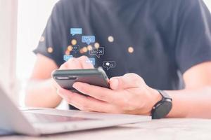 man using mobile smart phone Social media chat message and Marketing network internet online concept. photo
