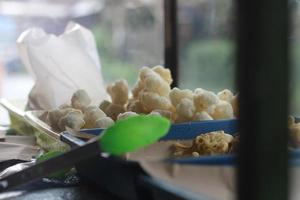 Geblek or cenolan is a traditional food from salaman, Magelang, made from tapioca flour and seasoned with savory fried onions. photo