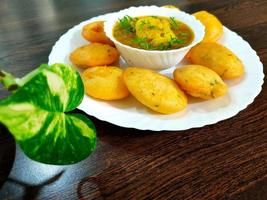 Jharkhand's famous snack Dhuska with potato curry photo