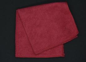 A red cloth for wiping. A terry towel. A rag for cleaning the premises. photo