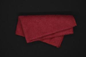 A red cloth for wiping. A terry towel. A rag for cleaning the premises. photo