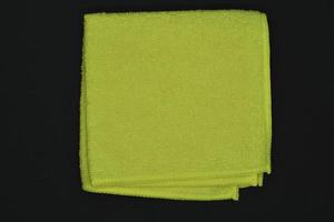 Yellow cloth for wiping. A terry towel. A rag for cleaning the premises. photo