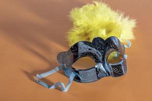 Venetian carnival mask, forming frame in one of the lower corners with space for text photo