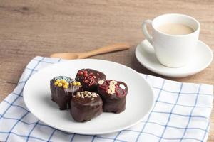 Chocolate ball snacks on a white plate photo