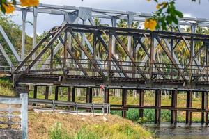 Steel railway bridge over the river photo