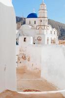 Blue domed church in Santorini, Greece photo