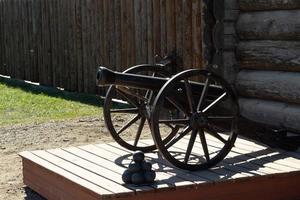 Old powder steel cannon for shooting cores photo