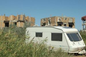 Trailer park concept, van in forest. Camper motorhome, house on wheels photo