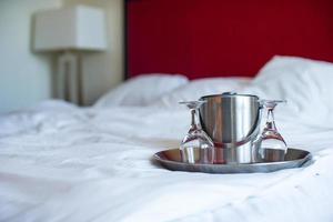 Glasses and metal bucket for couple in the bedroom for romantic night photo