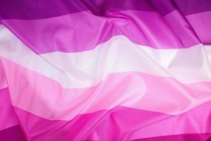 textile pink flag of lesbians,  concept of the fight for equal rights photo