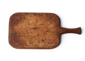 very old vintage cutting board with a handle made of oak photo