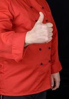 cook in red shows gesture like photo