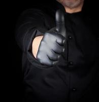 cook in black shows gesture like photo