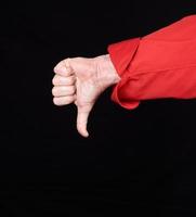 cook in red uniform  shows gesture dislike with hands photo