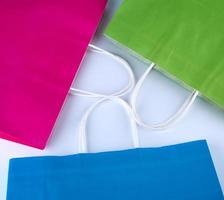 pink, blue and green paper shopping bags with a handle photo
