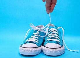 pair of blue textile sneakers photo