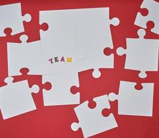 white big puzzles on a red background photo