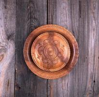 empty round brown carved decorative plate photo