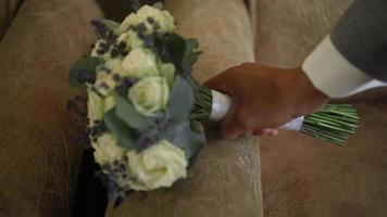 the groom picks up a bouquet video