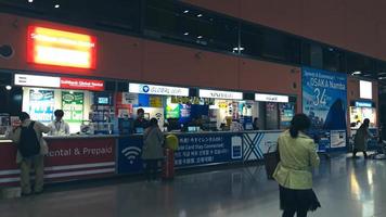 Osaka, Japan on April 9, 2019. A collection of sim card and wifi sales counters to meet the internet needs of foreigners visiting Japan. photo