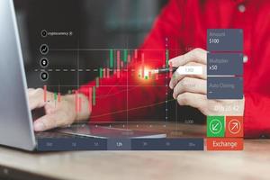 Financial stock market graph concept man working computer trading stocks and cryptocurrencies By analyzing technical charts and making informed decisions on online trading boards. photo