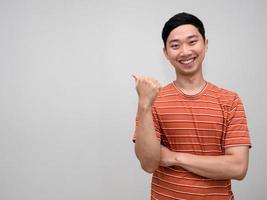 Positive asian man orange striped shirt smile crossing arms isolated photo