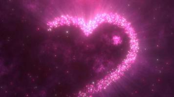 glühend Rosa Liebe Herz gemacht von Partikel auf ein Rosa festlich Hintergrund zum Valentinstag Tag. Video 4k, Bewegung Design