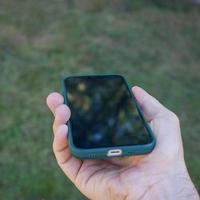 mano participación un inteligente teléfono, teléfono adiccion foto