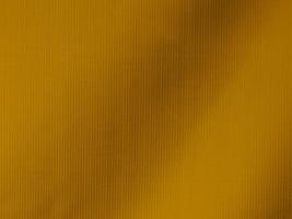 Yellow  velvet fabric texture used as background. Tone color Yellow cloth background of soft and smooth textile material. There is space for text and for all types of design work. photo