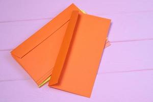 Group of colorful envelopes on wooden table, mock up photo