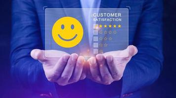 User gives rating to service experience on online application, Customer review satisfaction feedback survey concept, Customer can evaluate quality of service leading to reputation ranking of business. photo