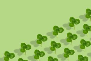 Clover leaf pattern on colored background. Abstract background for St. Patrick's Day photo