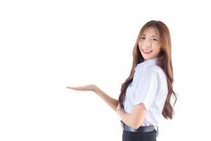 Portrait of an adult Thai student in university student uniform. Asian beautiful girl standing to present something confidently isolated on white background photo