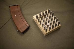 Ammo for machine gun. Bullets for firearms. Details of military equipment. photo