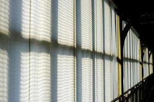 Sunlight Shining through Window that Covered with White Curtain. photo